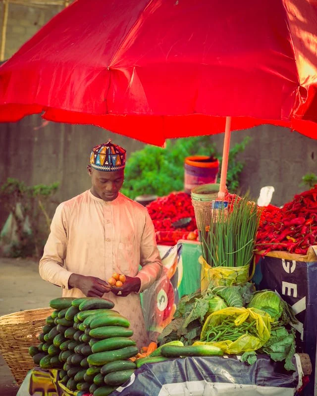 Open-air market trader stall with fresh produce
